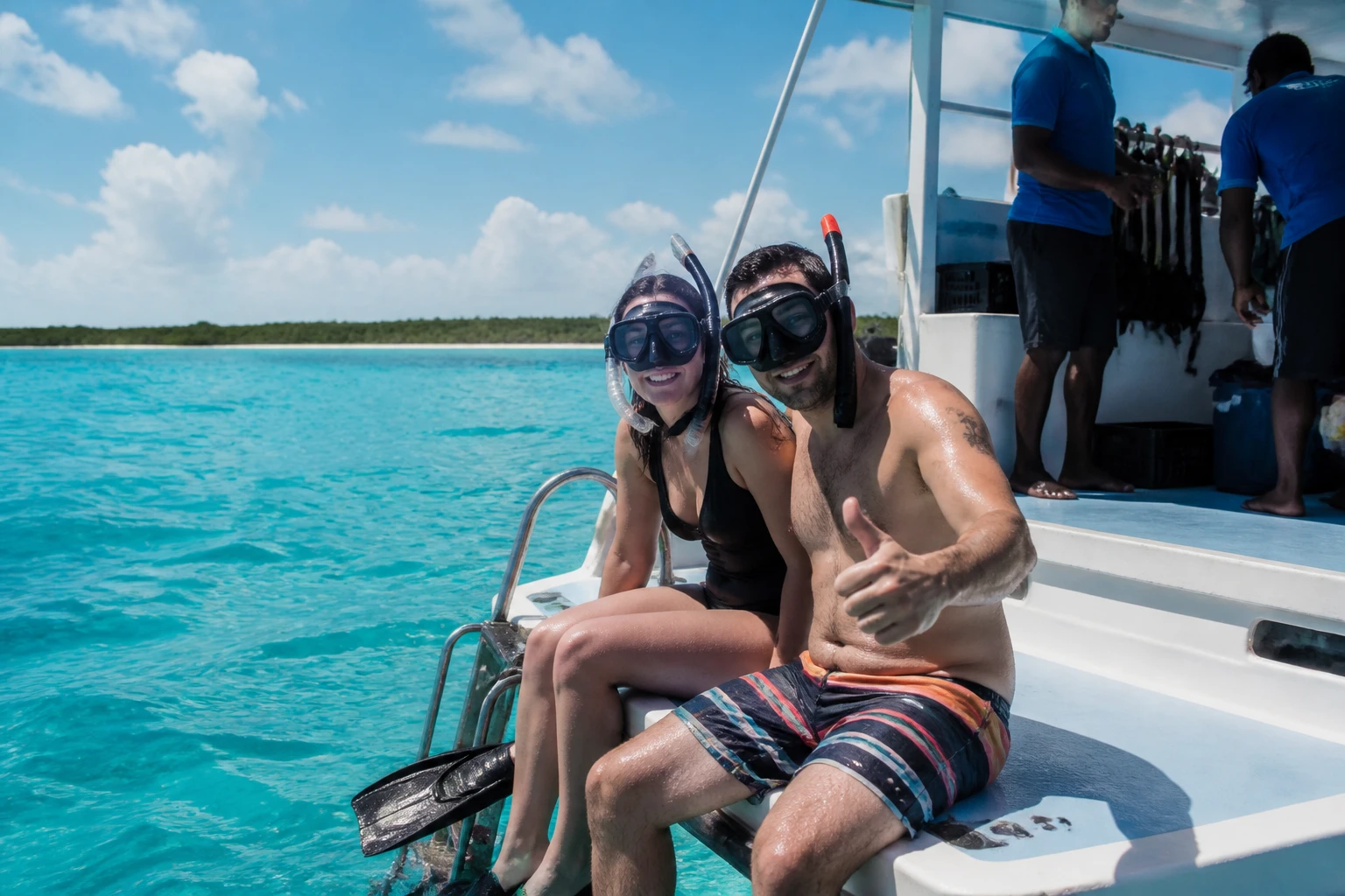 Travelers preparing to snorkel from a Punta Cana tour boat
