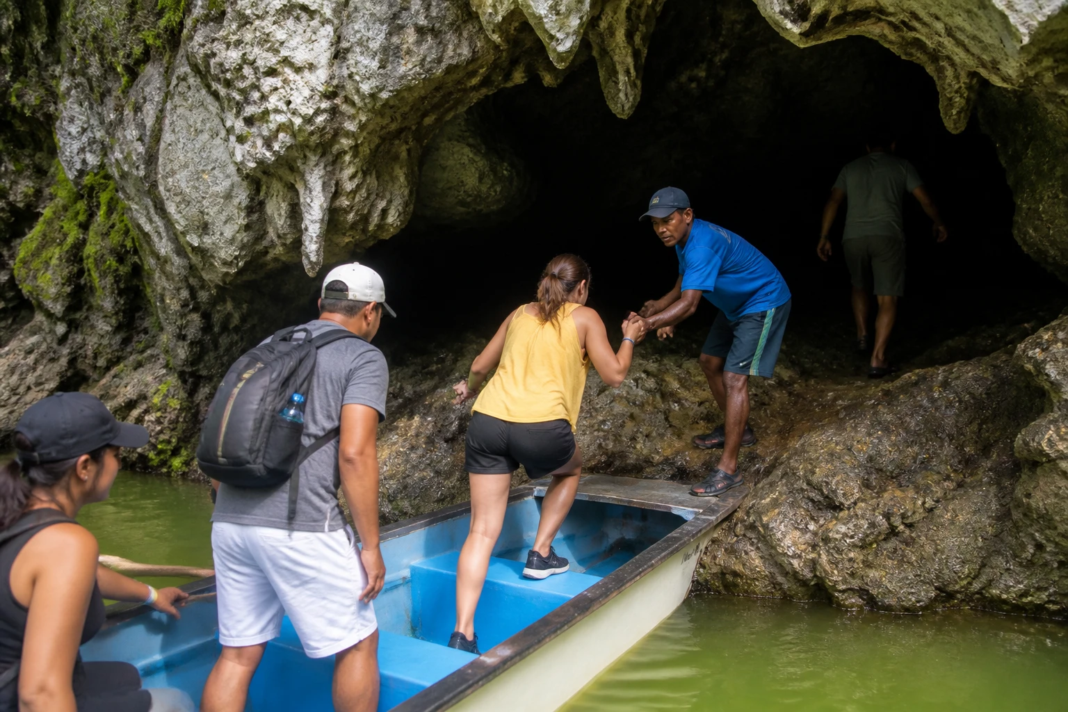 Visitors approaching a cave by boat in Los Haitises