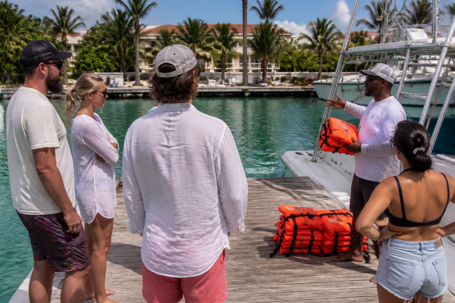 Safety briefing beside life jackets at a tropical marina