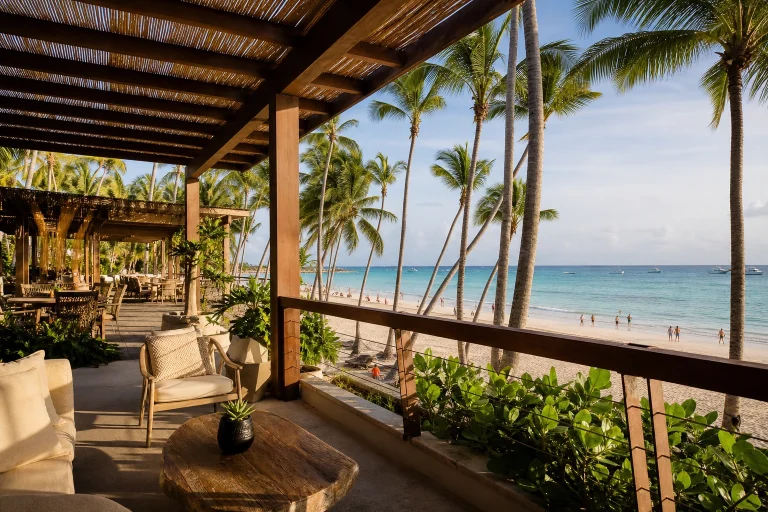 Luxury resort terrace overlooking a palm-lined beach in Punta Cana